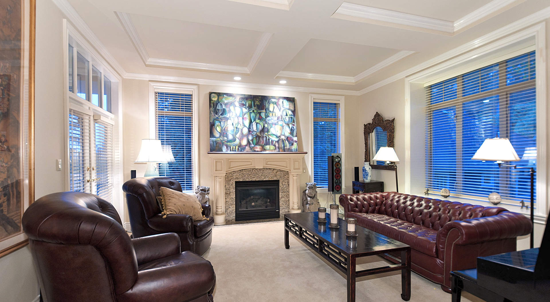 Traditional Living Area with Coffered Ceilings & Fireplace